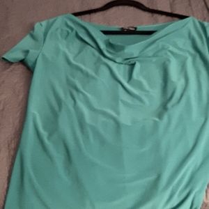 Turquoise short sleeved blouse with cascading neckline in the front